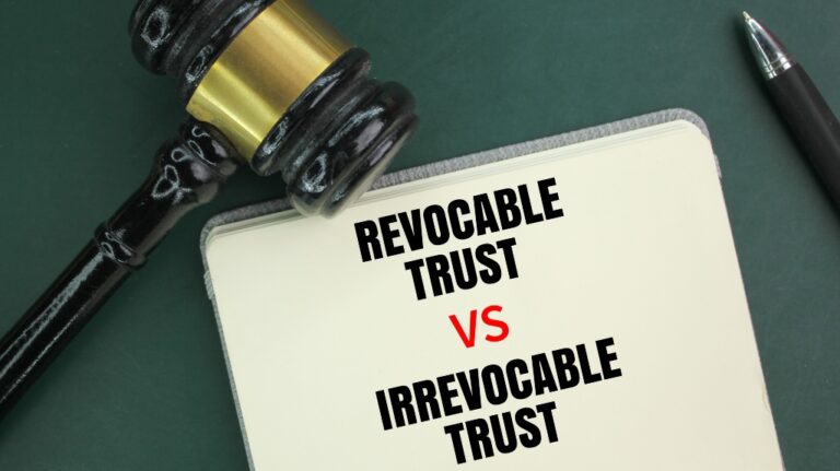 Judge's hammer, pen and book with the words Irrevocable Trust vs Revocable Trust