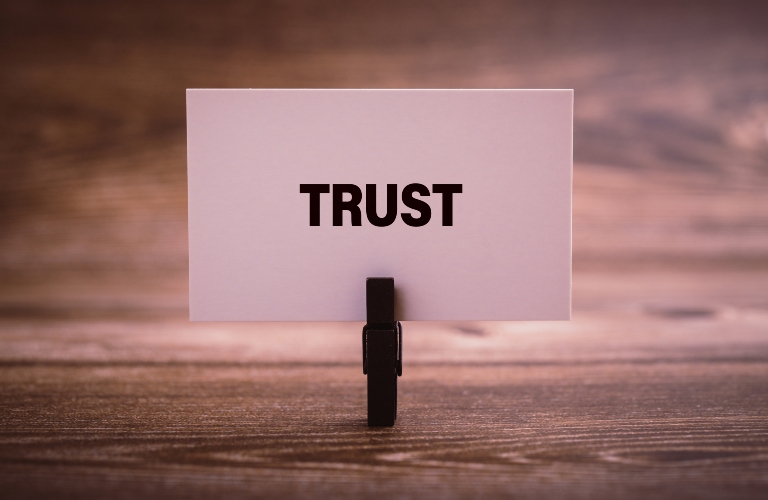Trust word written on the paper