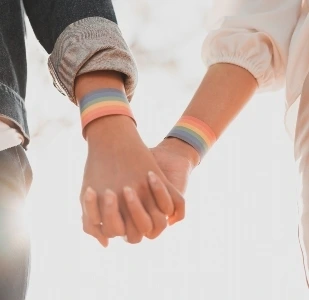 LGBTQ couple holding hands