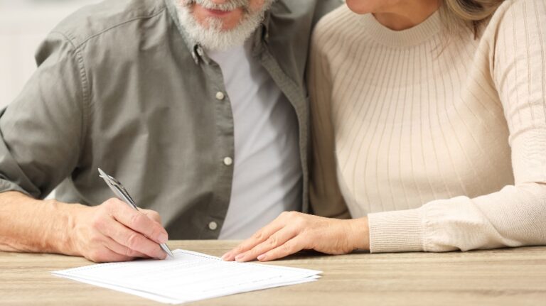 Senior couple is writing last will